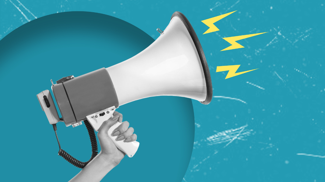 A hand holding a white megaphone against a bright blue background, with yellow lightning bolt shapes emerging from the megaphone to represent loud sound or amplification.
